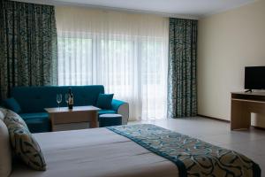 Un pat sau paturi într-o cameră la Park hotel Bellevue
