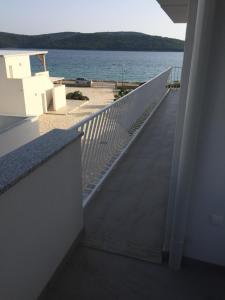 a view of the ocean from the balcony of a building at Apartments Branka in Zablaće