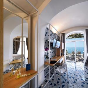 a living room with a view of the ocean at Hotel Montemare in Positano