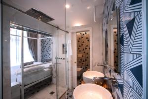 a bathroom with a toilet and a sink and a shower at Hotel Montemare in Positano