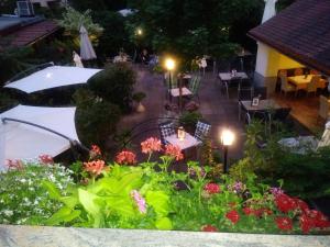 a street scene with flowers and umbrellas at Hotel Alter Telegraf in Graz