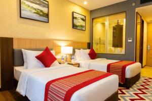 Postel nebo postele na pokoji v ubytování Vivanta Chitwan Bharatpur