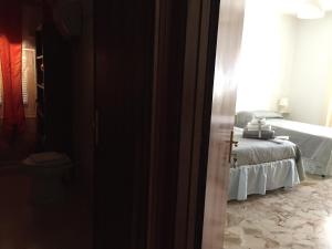 Postel nebo postele na pokoji v ubytování B&B Dell'Annunziata