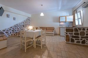 A kitchen or kitchenette at Filoxenia Apartments