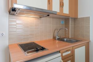 A kitchen or kitchenette at Filoxenia Apartments Még 37 kép