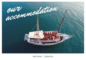 a boat in the water with the words our accommodation at Rhythm Floating Accom - Split in Split
