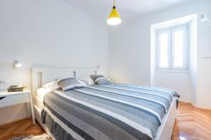 Postel nebo postele na pokoji v ubytování Apartments Simović