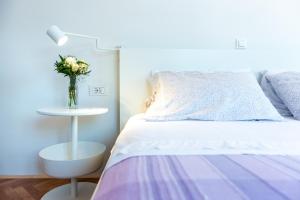 Postel nebo postele na pokoji v ubytování Apartments Simović