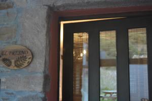 a door to a house with a sign on it at Apartamentos Torre Villar in Villar de Vildas