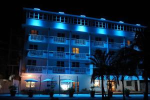 a hotel lit up at night with blue lights at BOHO Beach Club in Boqueron
