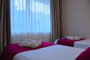 Łóżko lub łóżka w pokoju w obiekcie Apartamentos Fuerteventura Sol