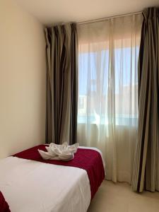 Łóżko lub łóżka w pokoju w obiekcie Apartamentos Fuerteventura Sol