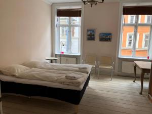 מיטה או מיטות בחדר ב-Outhentic Apartment