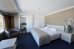 Postel nebo postele na pokoji v ubytování Hotel des Ardennes