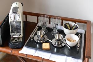a table with a mixer and some bowls and cups at Chambres Houdaille in Honfleur