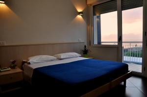 Postel nebo postele na pokoji v ubytování Albergo Riviera Spineta
