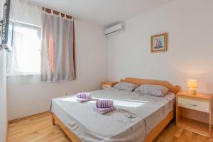 Postel nebo postele na pokoji v ubytování VILLA VIS MARIS