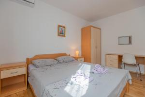 Postel nebo postele na pokoji v ubytování VILLA VIS MARIS