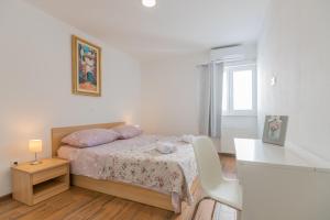 Postel nebo postele na pokoji v ubytování VILLA VIS MARIS