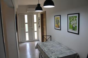 a hallway with a door and a table in a room at Casa Agava Becici in Becici