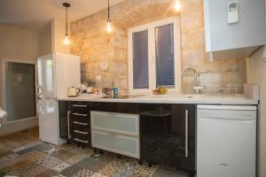 Kuchyňa alebo kuchynka v ubytovaní Casa Carminatti Apartments