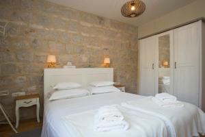Postel nebo postele na pokoji v ubytování Casa Carminatti Apartments