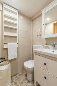 a bathroom with a toilet and a sink at Park Residence in Split