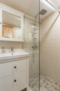 a bathroom with a sink and a shower at Park Residence in Split