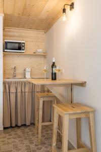 a kitchen with a table with two glasses of wine at Park Residence in Split