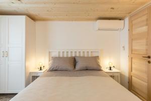 a bedroom with a large bed with two night stands at Park Residence in Split