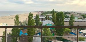 a view from a balcony of a beach and a building at Золотий ЛЕВ in Zatoka +55 photos