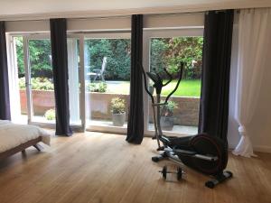 a room with a exercise bike in front of a window at Villa Drita in Alsdorf