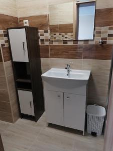 a bathroom with a sink and a mirror at CENTRO in Štúrovo +28 photos