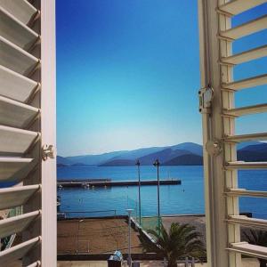 a view of a body of water from a window at Apartments Neda in Drače