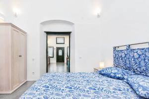 En eller flere senger på et rom på Casa d'Argento