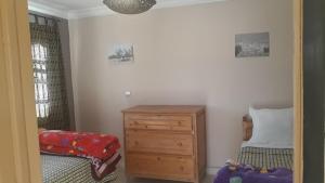 Katil atau katil-katil dalam bilik di Ecolodge Espace Tamount
