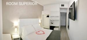 Posteľ alebo postele v izbe v ubytovaní Hotel Acapulco