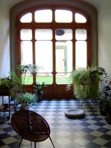 a room with potted plants in front of a door at Le Tre Stanze in Florence