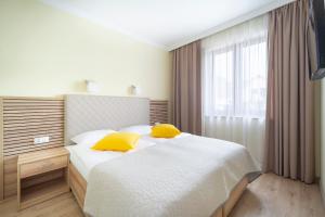 Posteľ alebo postele v izbe v ubytovaní Apartamenty Fregata