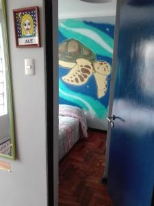 Cama o camas de una habitación en La Casa Azul Hostel