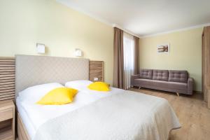 Posteľ alebo postele v izbe v ubytovaní Apartamenty Fregata
