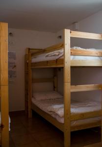 a couple of bunk beds in a room at Travellers' Haven in Bled