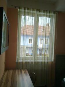 A bed or beds in a room at Gasthof Paradiesgartl