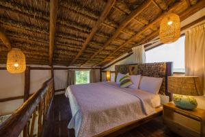 Postel nebo postele na pokoji v ubytování Spirit Holbox