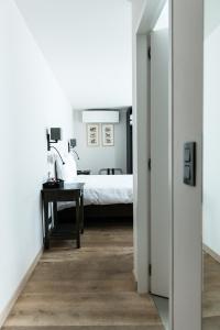 A bed or beds in a room at Maison de la Paix