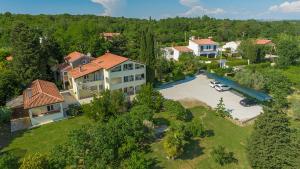 an aerial view of a large house with a yard at Apartments Saladinka in Poreč
