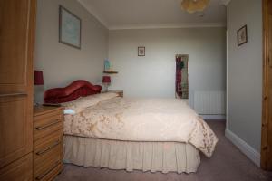 Voodi või voodid majutusasutuse Glendower B&B toas +30 fotot