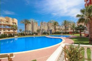The swimming pool at or close to Miradores Del Puerto One Bedroom Apartment RP019