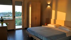 Postel nebo postele na pokoji v ubytování Albergo Riviera Spineta