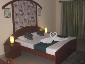 Кровать или кровати в номере A's Holiday Beach Resort